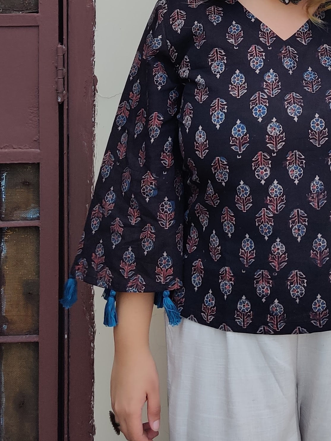 Kaala Khatta Ajrakh Bell Sleeves Top with Tassels